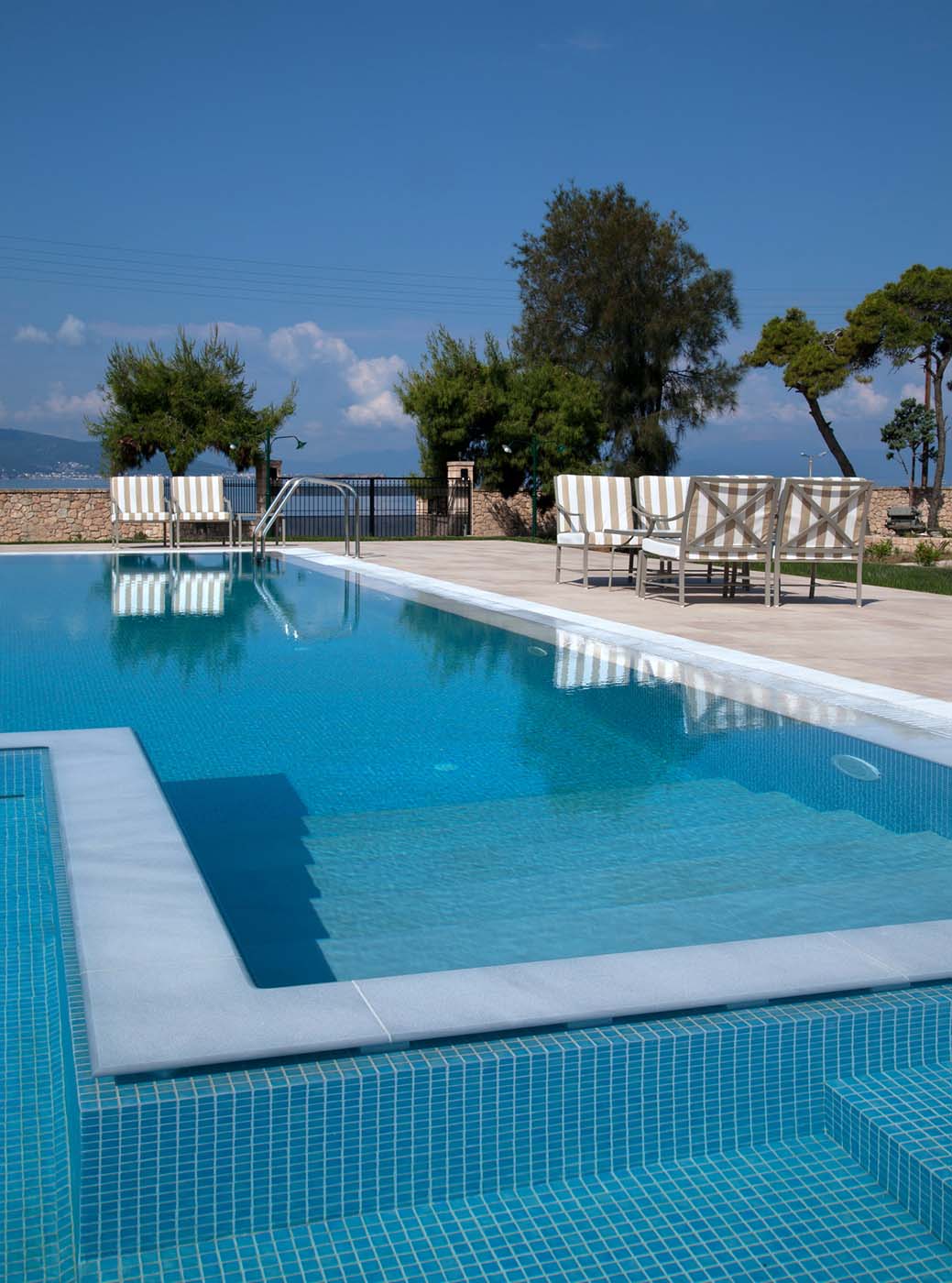 Pool at sunset with loungers